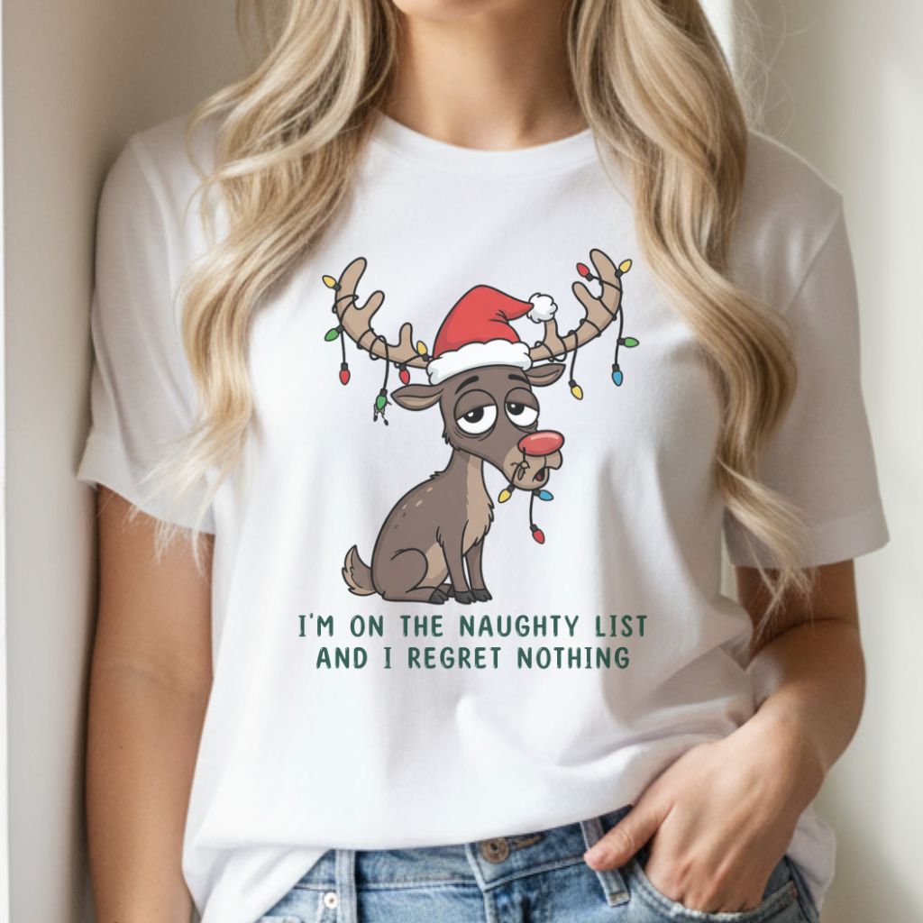 Woman wearing white Christmas t-shirt with funny reindeer design, smiling in cozy holiday home setting.