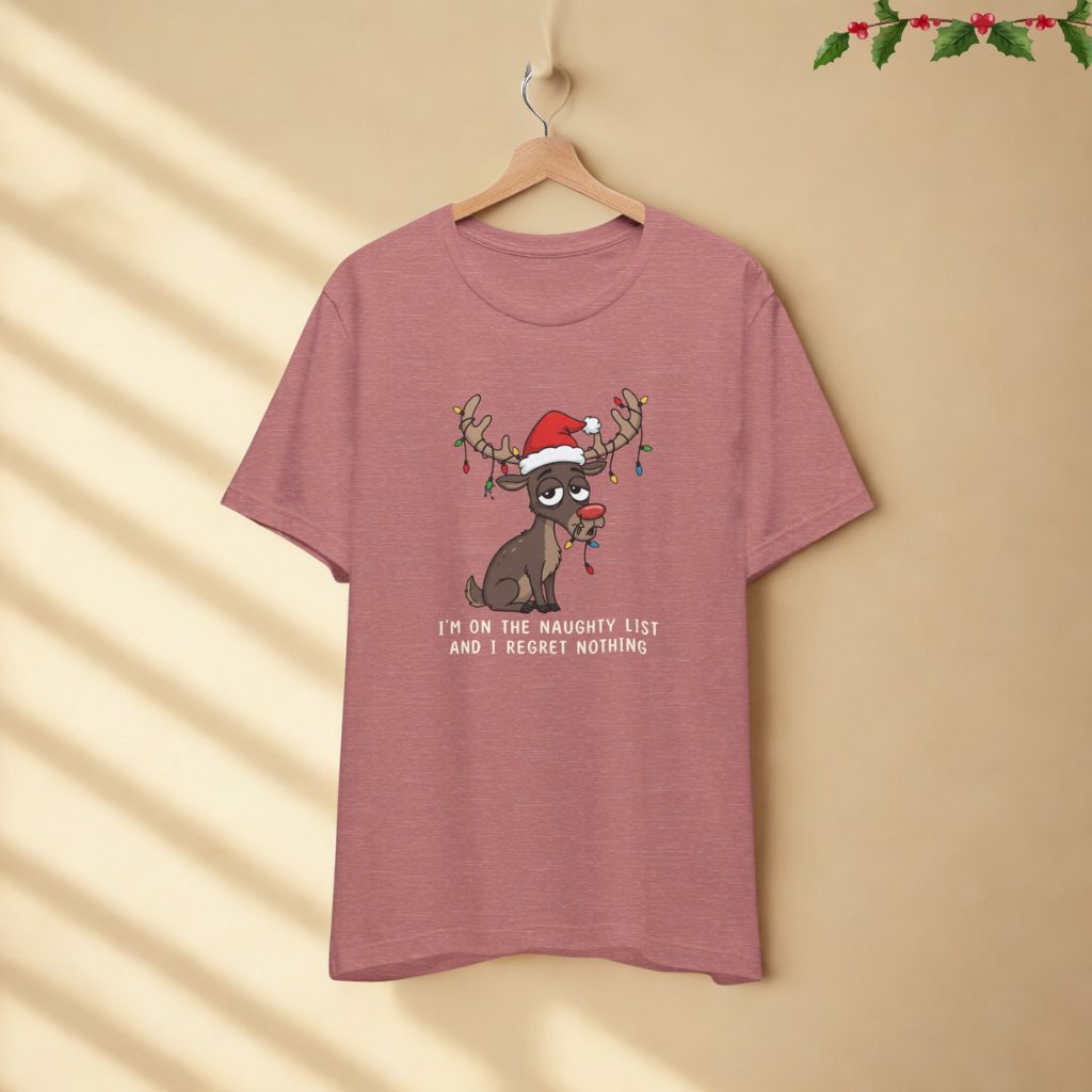 I’m on the Naughty List and I Regret Nothing funny Christmas t-shirt in heather mauve color displayed on hanger against neutral background.