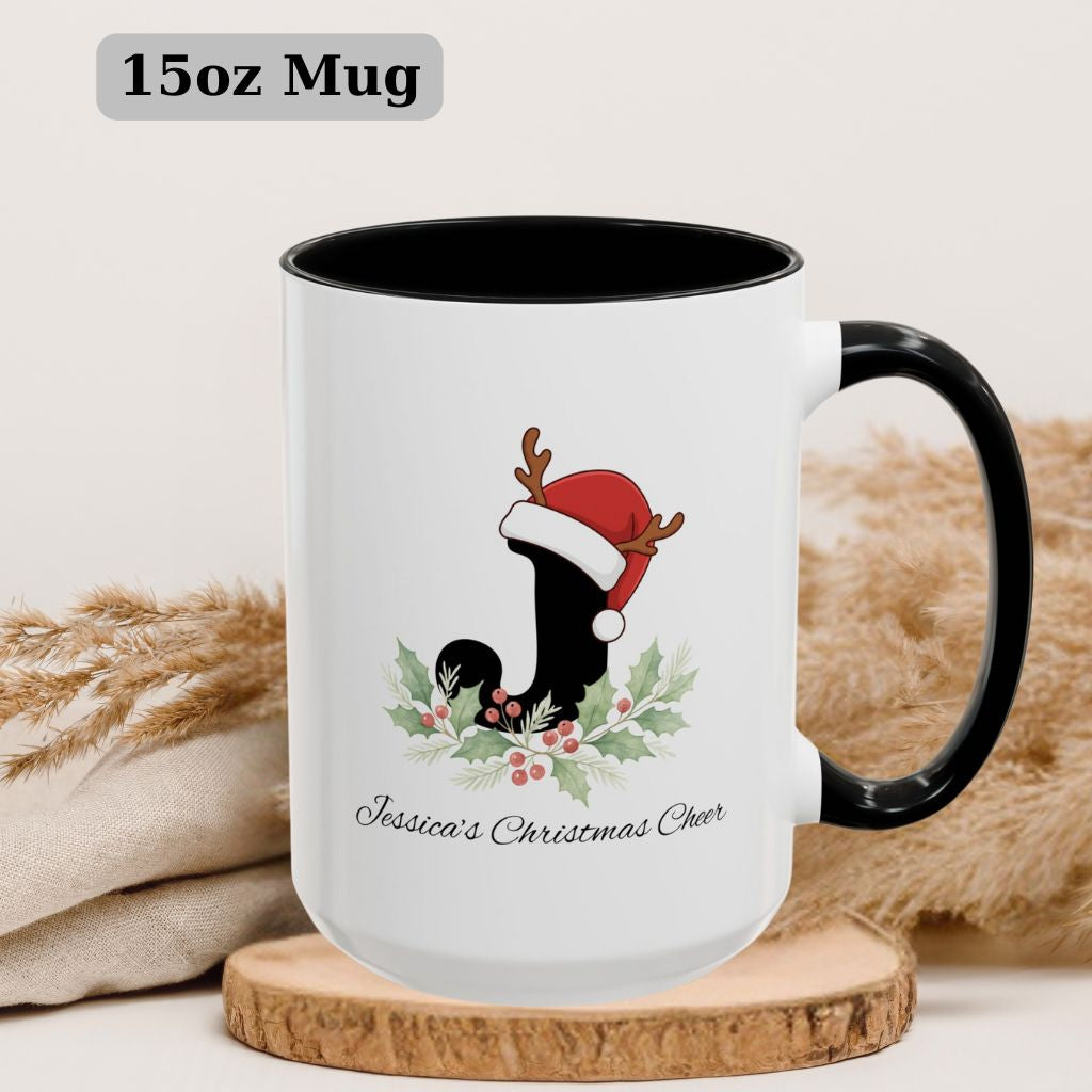 Black 15oz ceramic mug with red handle and custom Christmas letter design.