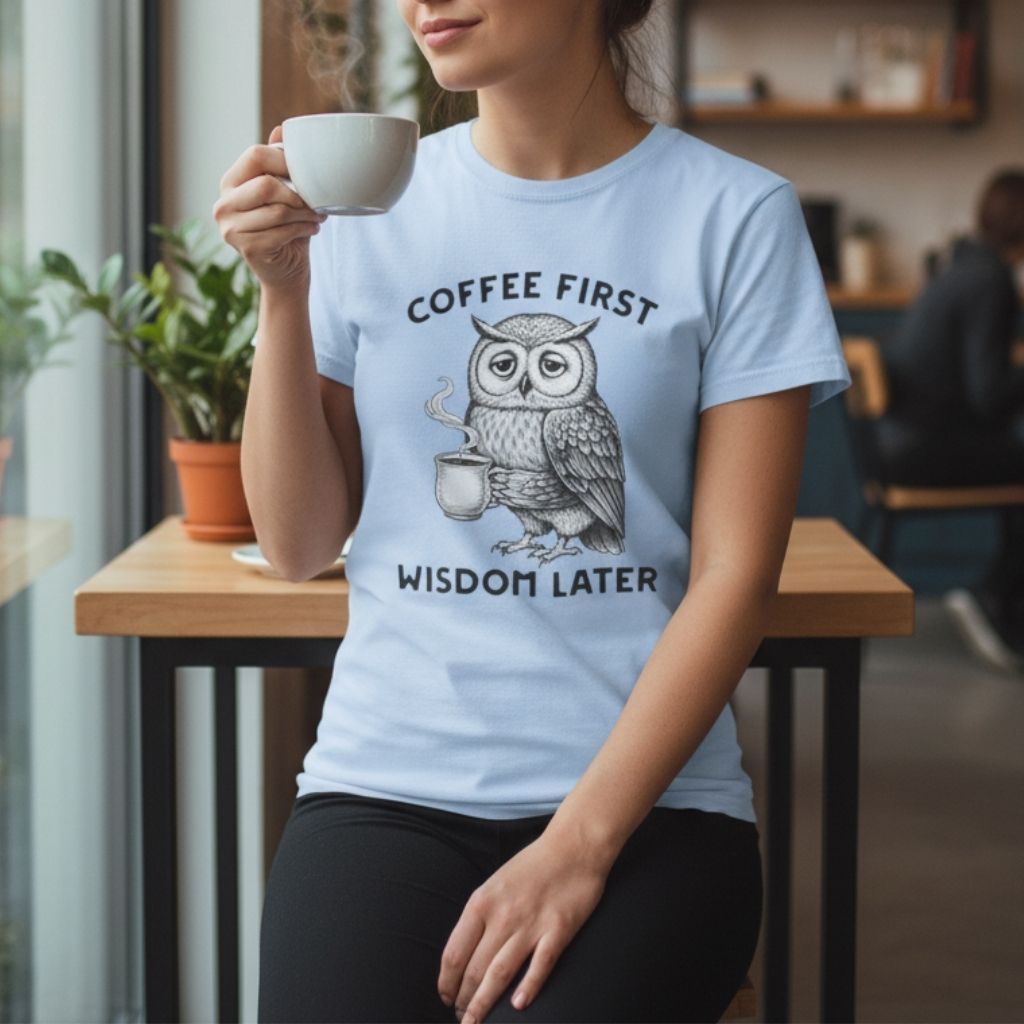 Women’s baby blue graphic tee featuring an owl with coffee, fun and modern outfit idea for coffee fans.