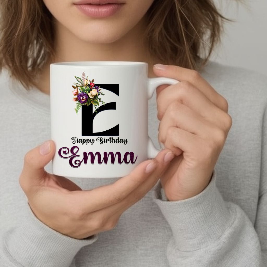 Woman holding 11oz birthday coffee mug with floral design