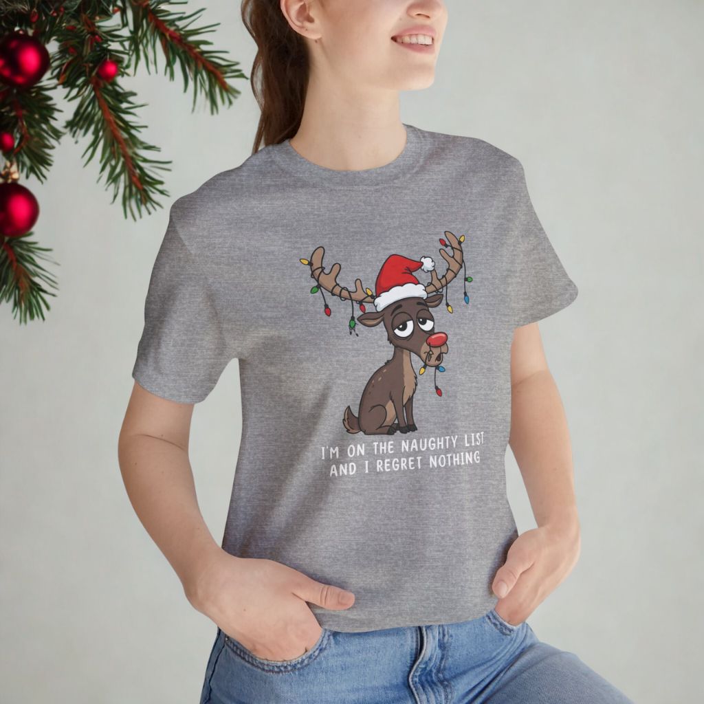 Woman wearing athletic heather gray holiday t-shirt with reindeer illustration, minimal and clean background.