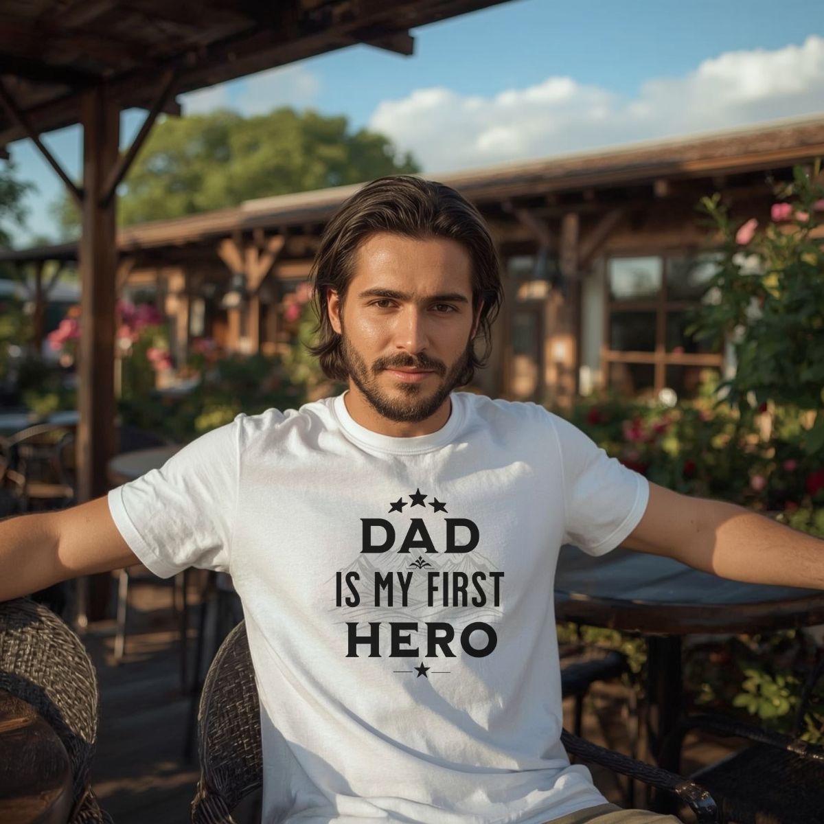 Man wearing 'Dad Is My First Hero' white t-shirt for Father's Day.