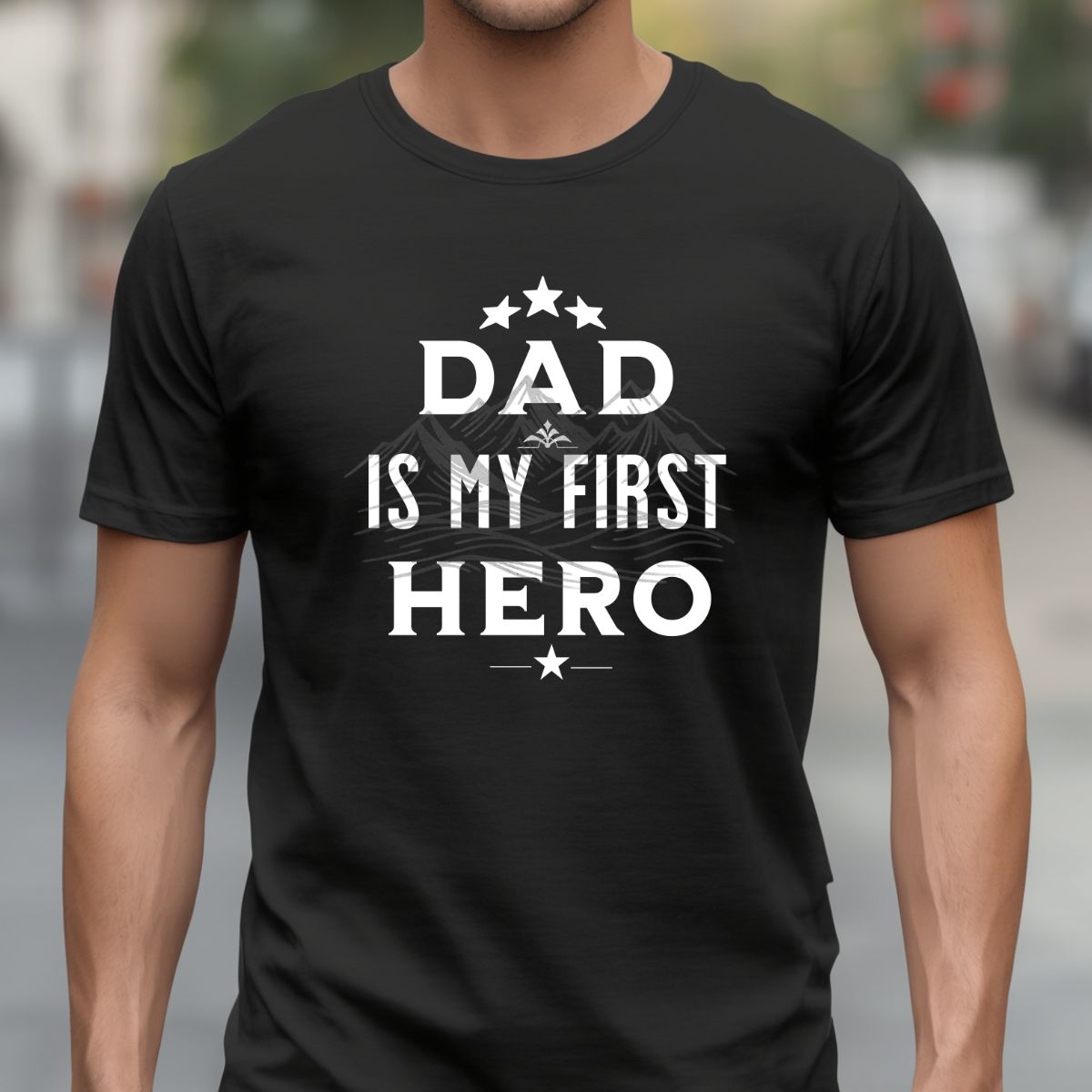 Man wearing 'Dad Is My First Hero' black t-shirt for Father's Day.