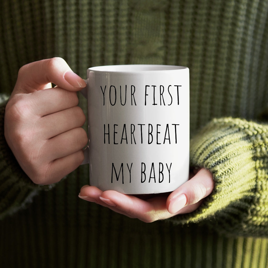 Personalized ceramic coffee mug featuring the touching caption, “your first heartbeat, my baby, my eternal love”.