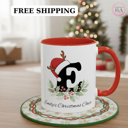Red-handled 11oz Christmas mug featuring winter landscape and festive initial design. Free Shipping