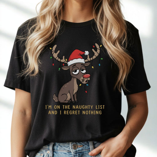 Female model wearing black funny Christmas t-shirt featuring reindeer with Santa hat, standing in modern festive living room.